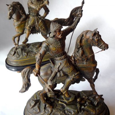 Pair of speltre statues of Cavaliers on rearing horses, on wooden bases. Circa 1920