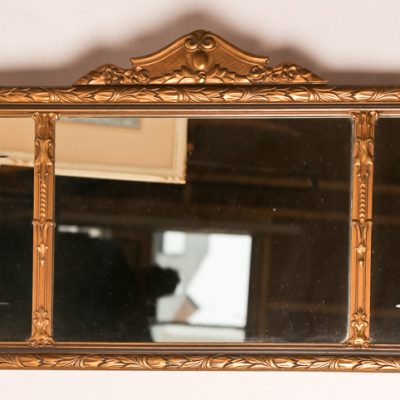  85   Wall mirror.  Three sections, in gilt plaster frame.  Early  20th century.   