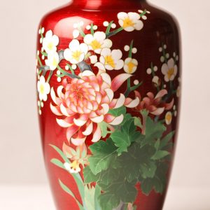 92.  Chinese cloisonné vase. With red ground and floral motif. Late 20th century. 