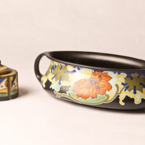 38.  Gouda porcelain bowl. Black ground with floral design. Double handled. With similar incense burner. Two pieces. Mid 20th century. 