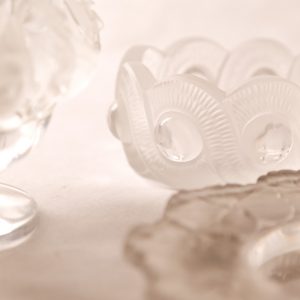 4.  Lalique collection. Vase with birds (minor chip); pin tray with leaves; bowl with round geometrics. Three pieces.  