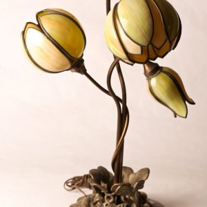 18.  Art Nouveau table lamp. Possibly bronze with green leaded glass shades in tulip form. Mid 20th century. 