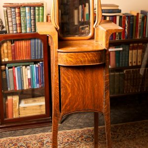 45.  Solid oak shaving stand. Swivel mirror above one shelf and one drawer and lower full door. Late 19th century. 
