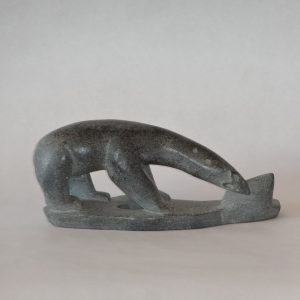 130.  Inuit soapstone carving - grey grained bear. Signed in syllabics.