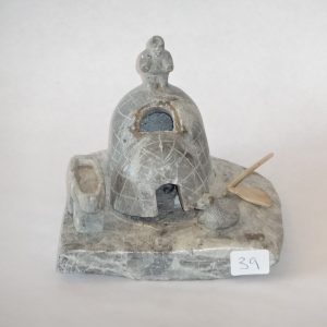 Inuit soapstone grouping. Grey grained Igloo scene. Signed in syllabics.