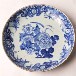 36. Chinese export porcelain charger. White ground and blue ink in peony and leaf design.  Ching Dynasty (Chien Lung period 1736-1795).  See accompanying paperwork.  