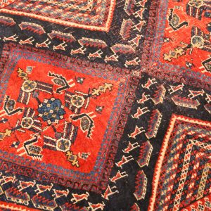 40. Persian Carpet.  Hand knotted wool.  Blue field with animal and geometric design. Early 19th Century.  *Note the Iranian import number (64812) determining it to be over 100 years old.  