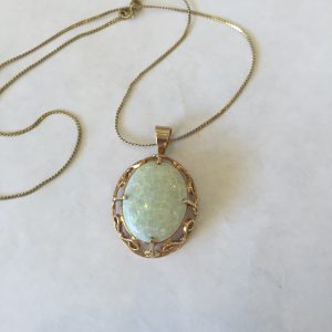 9. 14kt gold pendant with spectacular large fire opal.  